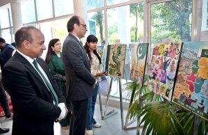 Federal Secretary Information and Broadcasting, Ashfaq Ahmad Khalil, cuts a ribbon to inaugurate a painting exhibition organized by the Directorate of Electronic Media and Publications (DEMP) in connection with Independence Day celebrations, at the Information Services Academy.
