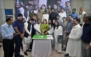 Acting Managing Director of Associated Press of Pakistan (APP) Sabeen Usman Khattak along with employees cutting cake during function in connection with Pakistan Independence Day celebrations at Information Service Academy (ISA).