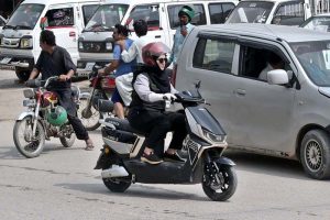 The morning traffic is already beginning to swell when a woman pulls down her helmet, places both hands firmly on the handlebar of her scooty and joins the moving stream of vehicles. There is nothing unusual about a vehicle entering traffic, yet the scene carries a significance that goes beyond the road. A woman who once waited for someone else to drive her is now choosing her own route, timing her own journey and deciding when she will return. (Match the photo with APP feature slugged “From passenger seat to handlebar: women take control of their journeys” already been released)