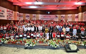 Chairperson of the Pakistan Red Crescent Society (PRCS), Farzana Naek, poses for a group photograph with participants during a seminar marking International Youth Day and International Humanitarian Law (IHL) Day at PRCS