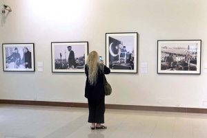 Visitor keenly viewing the photos during photographic exhibition titled “Quaid-i-Azam: The First Governor-General of Pakistan 1947–1948,” at the PNCA.