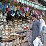 People are busy shopping at the weekly Sunday Bazaar, Peshawar Morr, in the Federal Capital