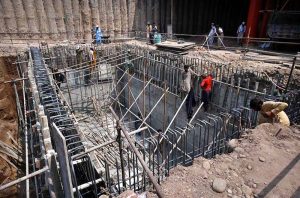 Labourers are busy in construction work of Kabutar Chowk underpass during development work in the city.