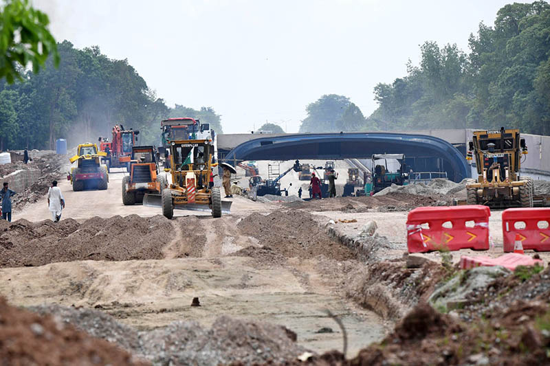 Heavy machinery is deployed at an underpass construction site along Park Road as development work progresses in the federal capital