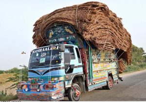 A truck overloaded with goods makes its way along Bypass Road, posing a potential road safety hazard.