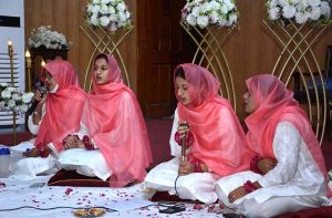 Students of Government College Women University Faisalabad (GCWUF) recite Naats in connection with Rabi-ul-Awwal at the university.