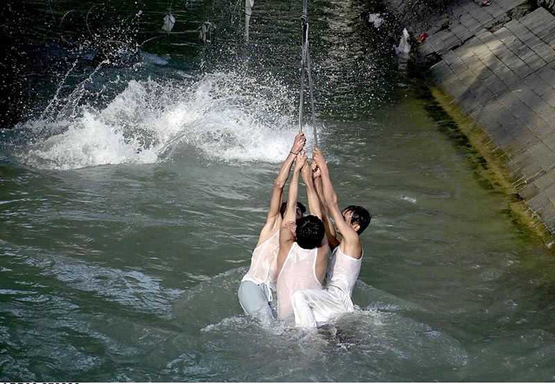 Youngersters are enjoying and playing in water of cannel channel made from of Khanpur dam in KPK most famous picnic point for tourists