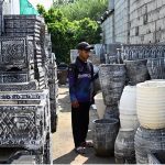 A vendor displays huge size plant pots to attract customers at H-9 Nursery in the Federal Capital
