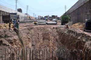 Labourers are busy in construction work of Kabutar Chowk underpass during development work in the city.