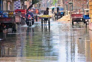 A view of sewerage water accumulated on the road at Liaqat Colony creating problems for motorists and pedestrians and needs the attention of concerned authorities
