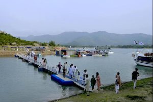 Youngersters are enjoying and playing in water of cannel channel made from of Khanpur dam in KPK most famous picnic point for tourists