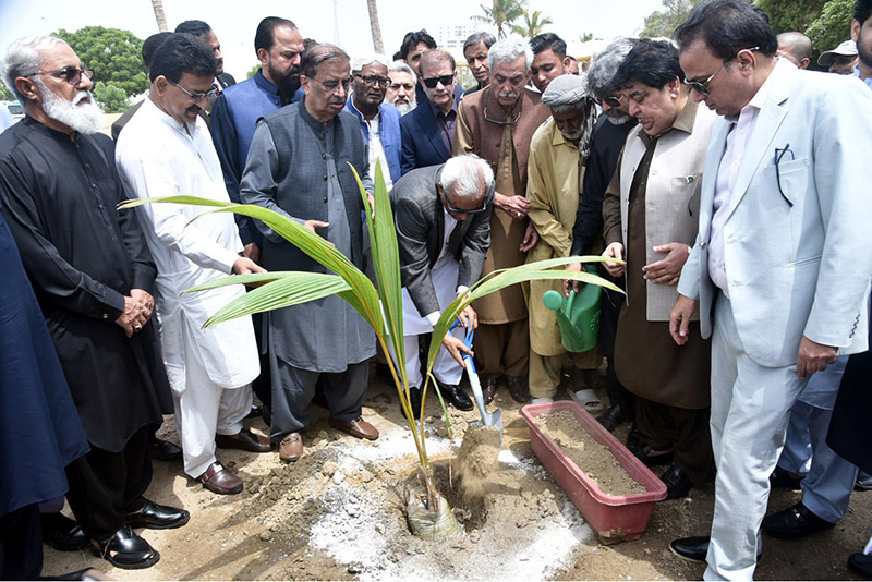Sindh Governor Syed Nehal Hashmi plants a sapling during a tree plantation ceremony at the Governor House