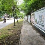 A poster is being displayed on the wall of a school in connection with the upcoming Eid Milad-un-Nabi (PBUH) in the Federal Capital