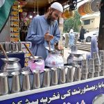 A vendor preparing Beverage (Lassi) for the customers in a local market of Federal Capital