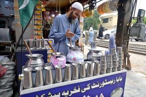 A vendor preparing Beverage (Lassi) for the customers in a local market of Federal Capital