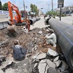 Workers are busy laying water pipelines with the help of an excavator on Saidpur Road during the city's water upgrading project