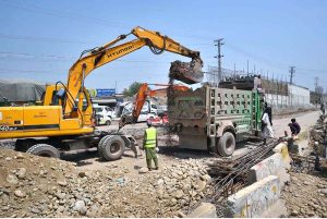 Laborers are engaged in the construction of an underpass at Phandu Chowk on Ring Road, where work is progressing to improve traffic flow and urban infrastructure in the provincial capital.
