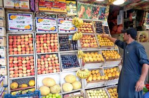 A vendor preparing Beverage (Lassi) for the customers in a local market of Federal Capital