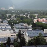 A beautiful scenic landscape of Faisal Mosque surrounded by clouds in the federal capital