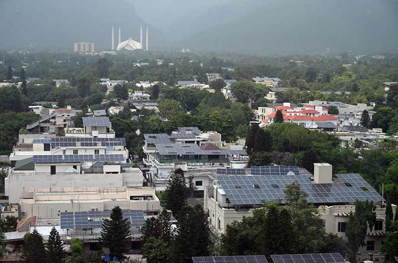 A beautiful scenic landscape of Faisal Mosque surrounded by clouds in the federal capital