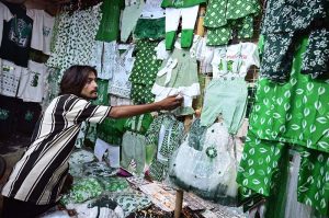 A vendor displays Pakistani national flags and Independence Day-themed outfits as the nation prepares to celebrate the country’s 79th Independence Day on August 14. APP/AKS/TZD/SSH