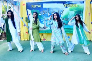 Students perform a folk dance to a national song during a programme at the Royal School System in connection with Pakistan’s 79th Independence Day celebrations.