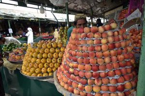 Vendors are arranging and displaying vegetables on their stalls to attract the customers at weekly Sunday Bazaar, Peshawar Morr in the Federal Capital