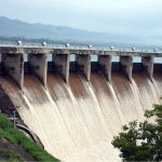 Spillway gates of Rawal Dam open to discharge floodwater following a heavy spell of monsoon rain in the Federal Capital