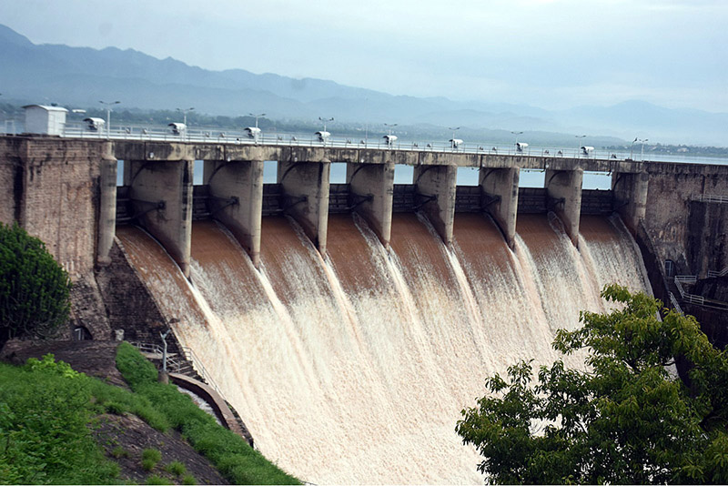 Spillway gates of Rawal Dam open to discharge floodwater following a heavy spell of monsoon rain in the Federal Capital