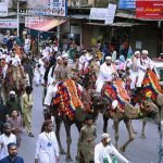 People participate in a Barkat Foundation (Trust) Pakistan rally from Numaish Chowrangi to Memon Masjid in connection with Eid Milad-un-Nabi (PBUH)