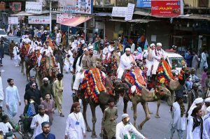 People participate in a Barkat Foundation (Trust) Pakistan rally from Numaish Chowrangi to Memon Masjid in connection with Eid Milad-un-Nabi (PBUH)