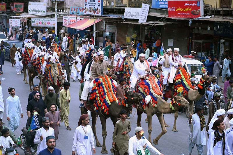 People participate in a Barkat Foundation (Trust) Pakistan rally from Numaish Chowrangi to Memon Masjid in connection with Eid Milad-un-Nabi (PBUH)