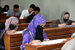 Candidates solving question paper during entry test for The University of Larkana