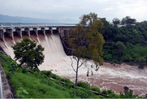 Spillway gates of Rawal Dam open to discharge floodwater following a heavy spell of monsoon rain in the Federal Capital