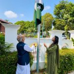 High Commissioner Rabia Shafiq raises the national flag to the tune of the national anthem during a flag-hoisting ceremony at Pakistan House, to mark the 79th Independence Day of Pakistan