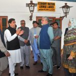 Federal Minister for Railways Muhammad Hanif Abbasi talks to senior railway officials during an inspection visit to the passenger facility areas, including the Economy Waiting Lounge for Ladies, at Multan Railway Station