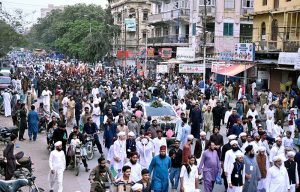 People participate in a Barkat Foundation (Trust) Pakistan rally from Numaish Chowrangi to Memon Masjid in connection with Eid Milad-un-Nabi (PBUH)