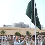 Federal Minister for Maritime Affairs Muhammad Junaid Anwar Chaudhry hoisting the national flag at Karachi Port Trust to mark 79th Independence Day