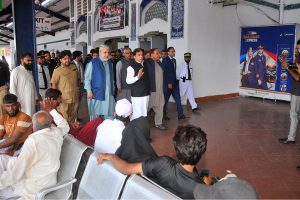 Federal Minister for Railways Muhammad Hanif Abbasi talks to senior railway officials during an inspection visit to the passenger facility areas, including the Economy Waiting Lounge for Ladies, at Multan Railway Station