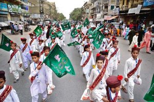 People participate in a Barkat Foundation (Trust) Pakistan rally from Numaish Chowrangi to Memon Masjid in connection with Eid Milad-un-Nabi (PBUH)