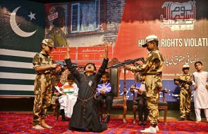 Students are presenting a patriotic tableau at the Sargodha Arts Council during an event marking 'Youm-e-Istehsal-e-Kashmir' (Day of Exploitation of Kashmir); the performance depicts the struggle of the Kashmiri people, as well as the brutality and human rights violations committed by Indian forces.