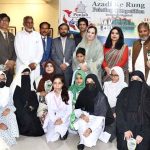 Parliamentary Secretary Shazia Rizwan poses for a group photograph with children who won prizes in a painting competition organized by the Rawalpindi Arts Council in connection with Independence Day celebrations