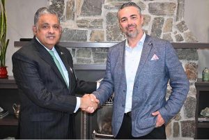 Ambassador Rizwan Sheikh shakes hands with Mr. Serge Mysin, Chief Financial Officer of MBanq, during a meeting on the digital economy and banking U.S. state of California .