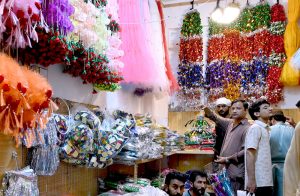 Shopkeepers are selling decorative items in connection with the celebration of Eid Milad-un-Nabi on Gumpat Road.