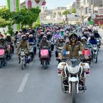 Chief Traffic Officer Muhammad Nabeel Khokhar leads a women empowerment and helmet awareness rally organized by City Traffic Police in the city