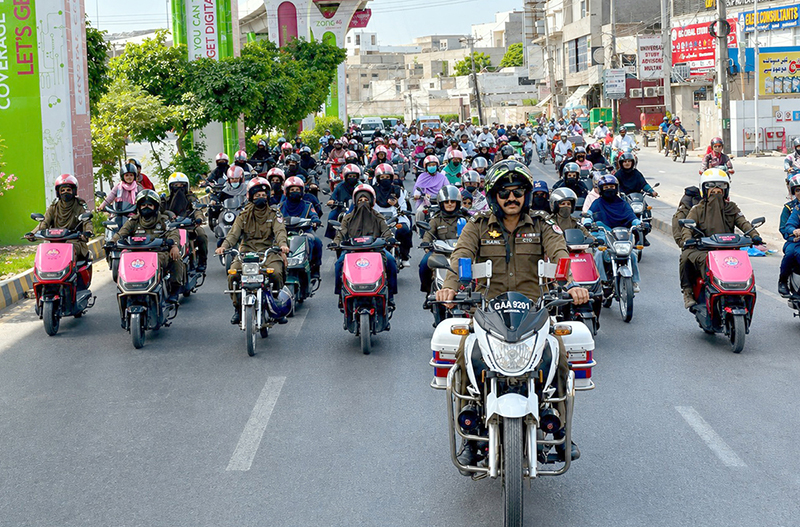 Chief Traffic Officer Muhammad Nabeel Khokhar leads a women empowerment and helmet awareness rally organized by City Traffic Police in the city