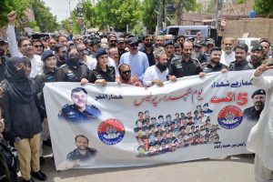 SP Shahzeb Chachar, accompanied by police officers, participates in a ceremony to observe Youm-e-Shuhada-e-Police to paying tribute to police martyrsoutside the SSP Office, .