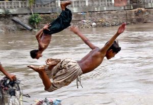 Youngsters jumping and bathing in Rice Canal to get relief from scorching hot weather due to increasing mercury in the city.