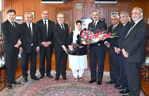 Chief Justice of Pakistan and Judges of the Supreme Court of Pakistan presenting the bouquet to Justice Musrat Hilali on eve of laying the robes of office at the Supreme Court.