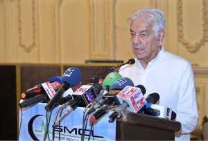 Defense Minister Khawaja Muhammad Asif addresses a ceremony held to mark the laying of the foundation stone of Sialkot Medical City Limited (SMCL)